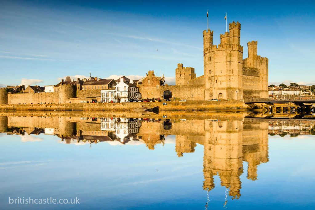 Caernarfon Castle reflected in the waters of the river Seiont